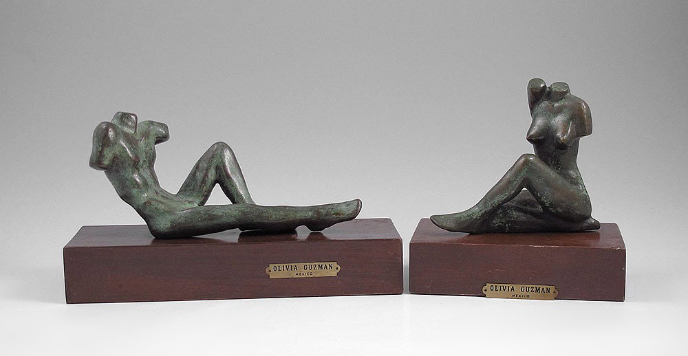 OLIVIA GUZMAN NUDE TORSO BRONZES: GUZMAN, Olivia, (Mexican, 20th C): Male And Female Reclining Nude Torsos, Bronze. Female figure is approximately 4 1/2'' in height x 4 3/4'' in width, affixed to a wooden plinth, 6'' overall in height