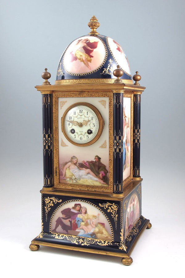 TIFFANY & CO. ROYAL VIENNA PORCELAIN CASE CLOCK: TIFFANY & CO. ROYAL VIENNA PORCELAIN CASE CLOCK: Tiered hand painted panels of various scenes including scantily clad women, putti and cherubs, artist and poet. Gilt metal tiers and ormolu accents, wi