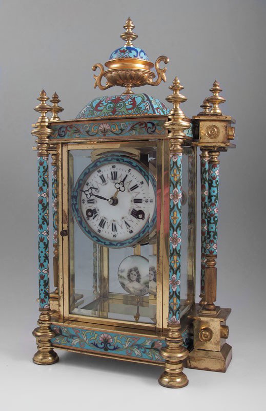 CLOISONNE & BRASS MANTLE CLOCK: CLOISONNE & BRASS MANTLE CLOCK: Floral design cloisonne over brass case with 6 full column supports and urn finial. Beveled glass front and sides, back glass appears to be replacement. Porcelain face 