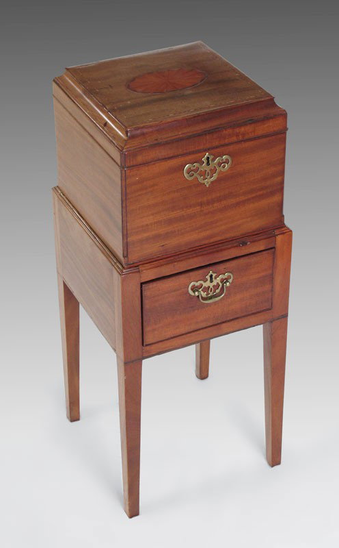 ANTIQUE CELLARET BOX ON STAND: ANTIQUE CELLARET BOX ON STAND: Pantera inlay on top and design of shell inlay to interior of the hinged top. The drawer in the stand and the box are key locking. Satinwood and mixed woods. On stand me