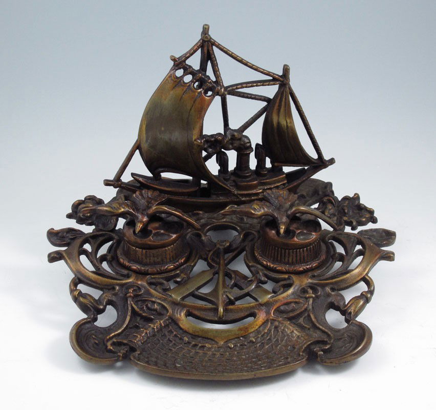 BRONZE NAUTICAL THEME INKWELL: BRONZE NAUTICAL THEME INKWELL: Featuring a steamer ship with sails, seagulls, oars and anchor. Unmarked. 9'' h. x 11'' x 12 1/2''.