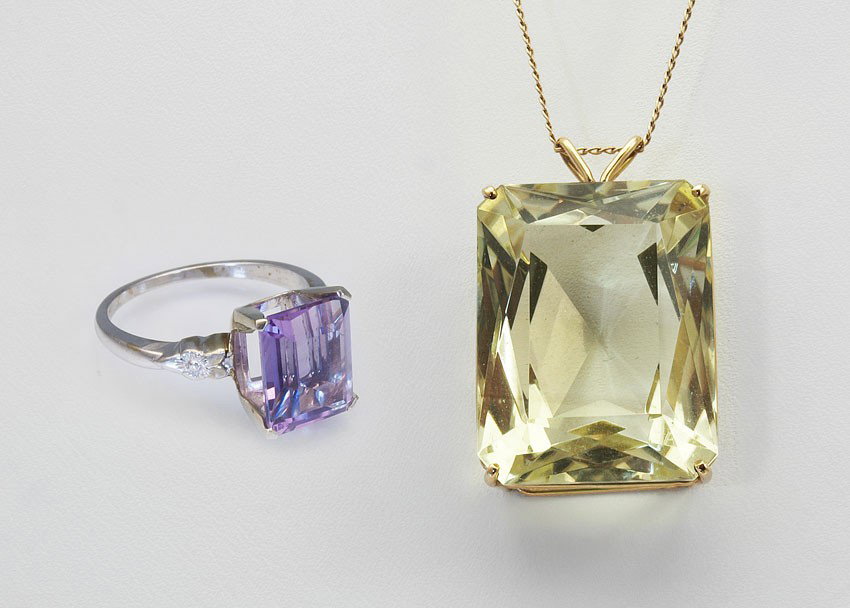 40CT CITRINE NECKLACE & 2.5CT AMETHYST RING 5.1 GR: ESTATE 40 CT CITRINE PENDANT AND 2.5 CT AMETHYST RING: 1) 14K white gold ring contains one 2.50 Ct. amethyst. The stone is chipped. Size: 5.5. sOLD WITH 2) 14K yellow gold 40.00 Ct. citrine . 18" chai