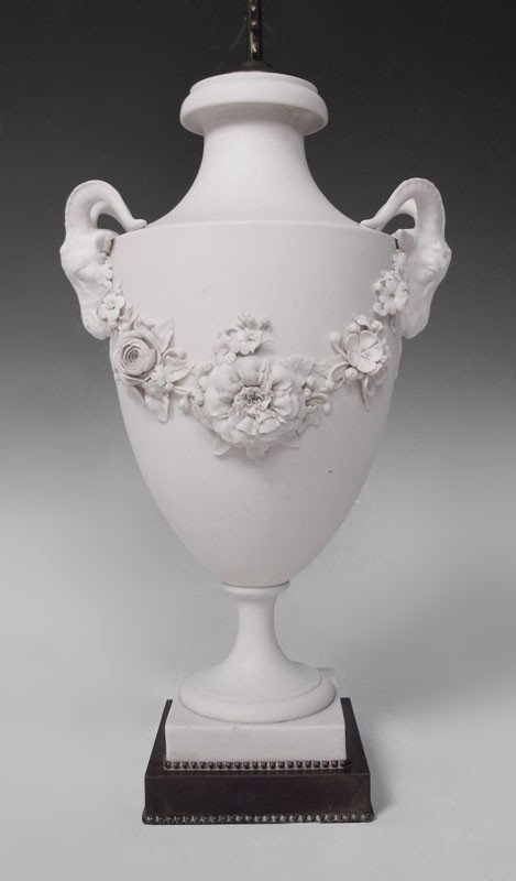 PARIAN RAMS HEAD LAMP: PARIAN RAMS HEAD LAMP: Undrilled parian urn with nicely detailed floral garland joining the prominent rams's heads. The urn is approx. 15" tall, lamp 31" overall.