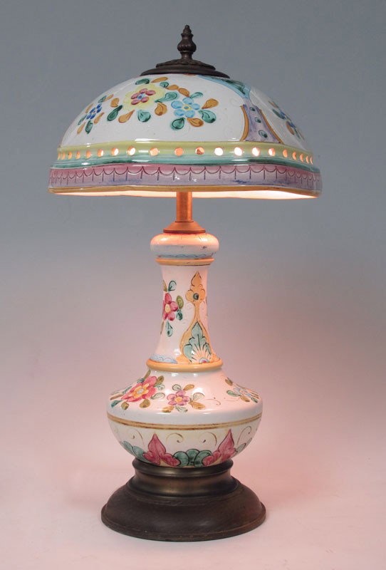 FAIENCE LAMP AND SHADE: FAIENCE LAMP AND SHADE: Vase form faience ceramic base and shade. Incised paint decorated floral motif. Base 14" h. x 8", shade 5 1/2" x 13".