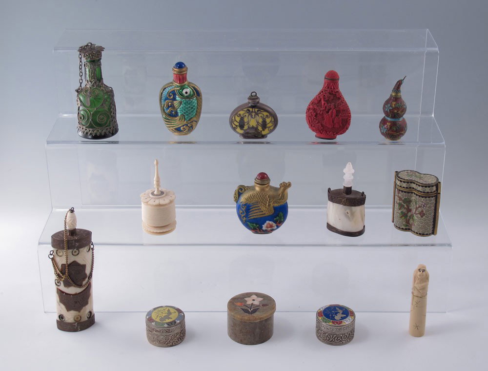 COLLECTION OF SNUFF BOTTLES & COVERED JARS: COLLECTION OF SNUFF BOTTLES & COVERED JARS: To include 1) An assortment of 8 snuff bottles including glass, cinnabar, cloisonné, bone and ivory, largest measures 5 1/8" l. 2) 4 covered boxes, 2 metal