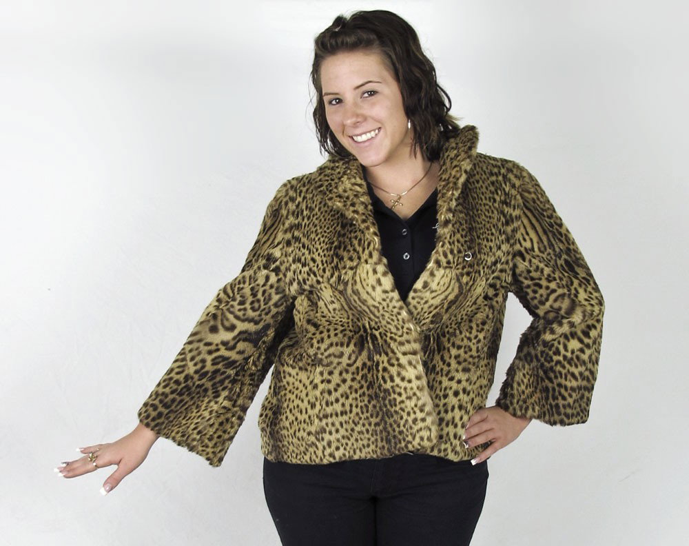 VINTAGE AMES & BROWNING FUR JACKET: VINTAGE AMES & BROWNING YOUNG LEOPARD FUR JACKET: Lined with tan floral satin with interior packets, eye hook closures and monogrammed on the inner right hand side. Jacket is small to medium in size a