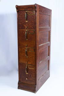 GLOBE 4 DRAWER OAK FILE CABINET: GLOBE 4 DRAWER OAK FILE CABINET: Four drawer Globe Oak filing cabinet with brass pulls. Globe tag located at the top dead center. Approx. 48.5'' h x 12'' w x 25.5'' d.