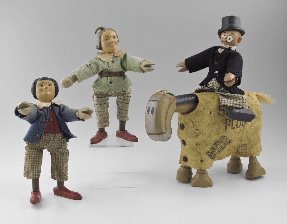 4 PIECE SCHOENHUT CARTOON FIGURES: 4 PIECE SCHOENHUT CARTOON FIGURES: To include 1) Small head Barney Google, 7 1/4'' h. 2) Spark Plug with blanket, 6 1/2'' h. x 9 1/2''. 3) Max & Moritz, 8'' h.