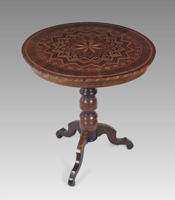 19TH C PARQUETRY INLAY TEA TABLE: 19TH C PARQUETRY INLAY TEA TABLE: Intricate starburst design on round top. The turned pedestal base and the legs also have parquetry. Measures 29" round, 27 1/2" tall.
