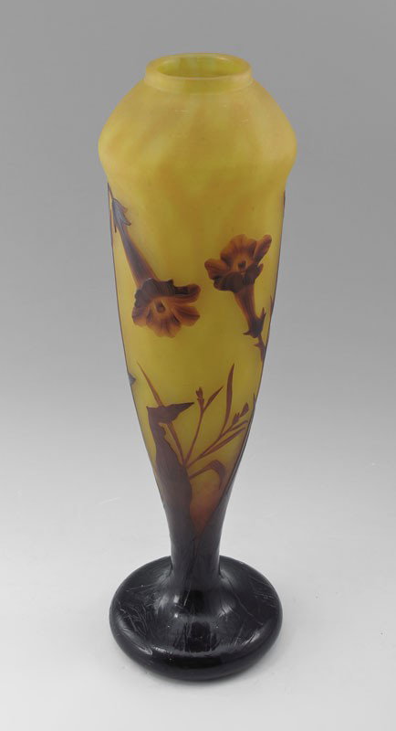 DAUM NANCY FRENCH CAMEO ART GLASS VASE: DAUM NANCY FRENCH CAMEO ART GLASS VASE: Early 20th C. Carved leaf and flower design in autumn colors. Signed Daum Nancy with the Cross of Lorraine. 16" tall.