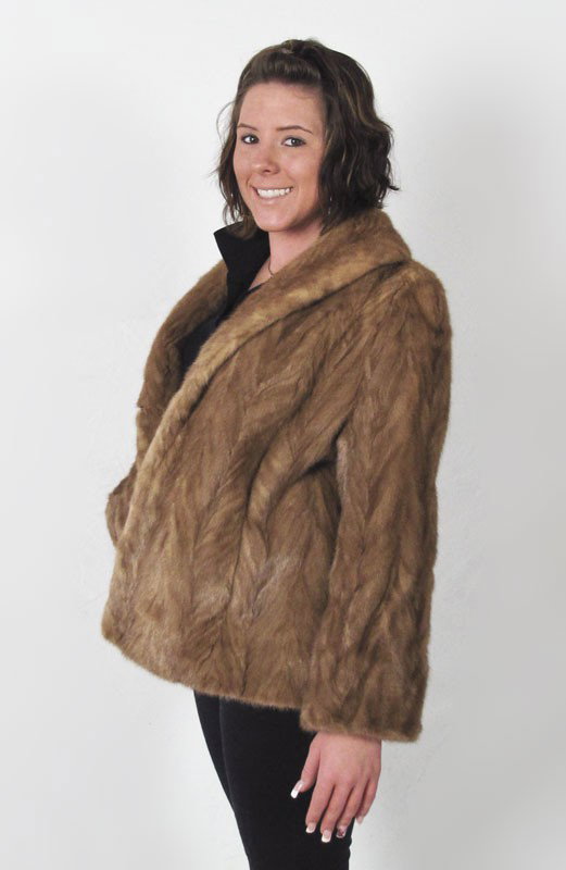 LILLIE RUBIN FUR JACKET: LILLIE RUBIN FUR JACKET: Fur is sewn in the V pattern, lined with a floral tan satin. Jacket has interior and exterior pockets and bell sleeves. Medium in size and 26 1/2" in length. There is a small 
