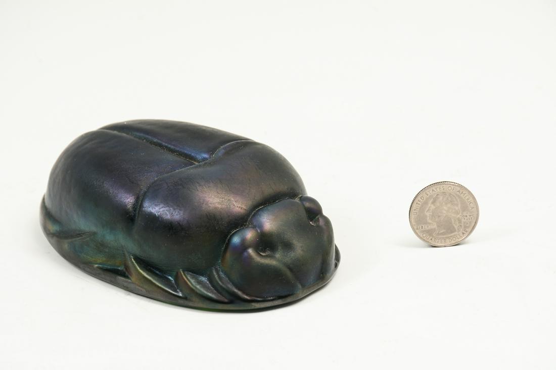 TIFFANY STUDIOS FAVRILLE GLASS SCARAB: TIFFANY STUDIOS FAVRILLE GLASS SCARAB: Unmarked. Approx. 1.5'' h x 4.75'' l x 2.75'' w.