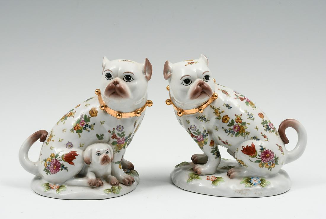 PR. MEISSEN STYLE PORCELAIN DECORATED DOGS: PR. MEISSEN STYLE PORCELAIN DECORATED DOGS: A set of opposing Porcelain dogs, decorated in a floral motif. Gold painted collars, Blue Crossed Sword mark with an ''R'' below. Approx. 7.5'' h x 7.5'' l 