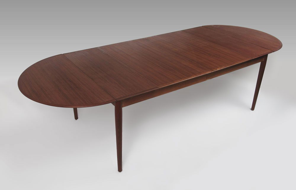 ARNE VODDER DANISH MODERN DINING TABLE: ARNE VODDER DANISH MODERN TEAK EXTENSION DINING TABLE: Banded top, tapered legs. Table with removable oval ended drop leaves and 2 extra leaves. The extra leaves have hinged skirts. Approx. 28 1/2''h.