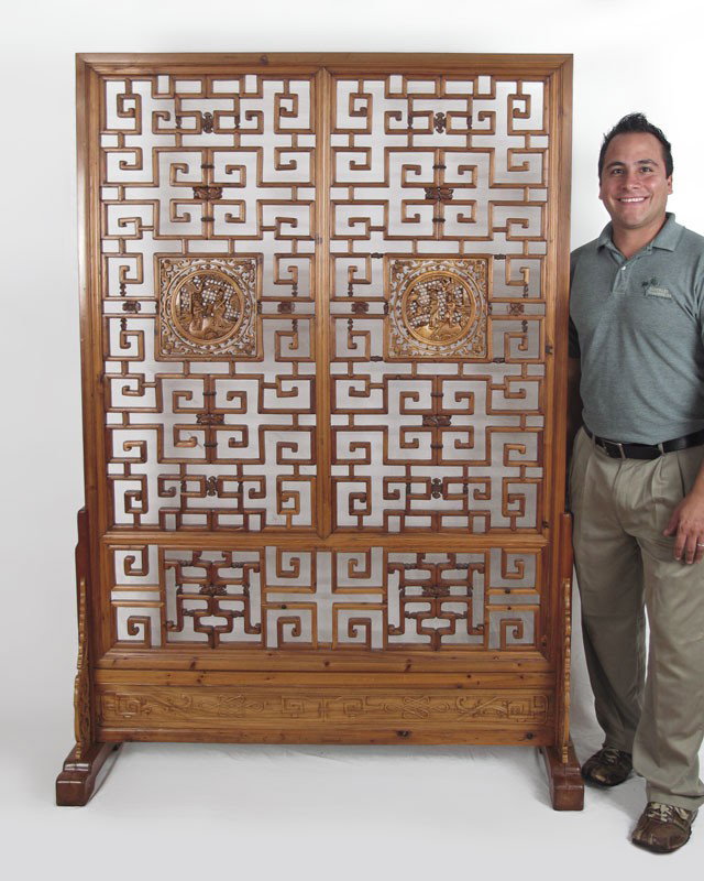 CHINESE CARVED FLOOR SCREEN: CHINESE CARVED FLOOR SCREEN: Carved geometric oriental pattern with 2 central carved square medallions. 73 1/4" h. x 52" x 16"