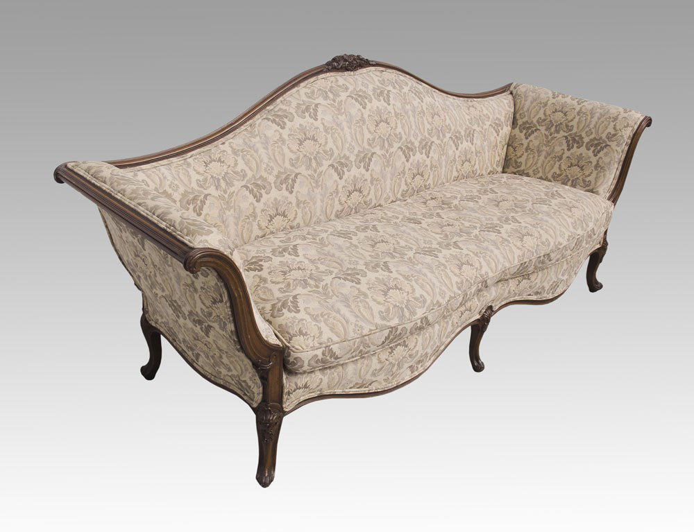 CARVED VICTORIAN UPHOLSTERED COUCH SOFA: CARVED VICTORIAN SOFA: Carved frame and feet with foliate scroll carved crest. Floral upholstery. 38" h. x 89 1/2" x 31".