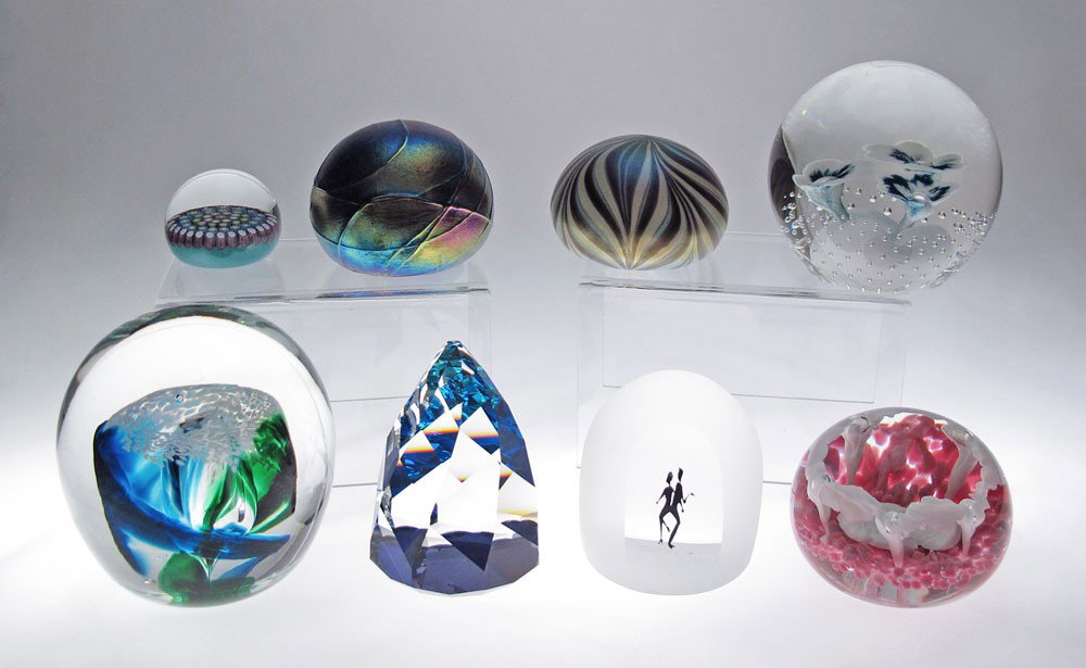 8 ART GLASS PAPERWEIGHTS: 8 ASSORTED PAPERWEIGHTS: Collection to include signed color changing faceted cone shaped Perthshire, signed Orient & Flume iridescent, a threaded and deep iridescent signed only OBG. illegibly signed 