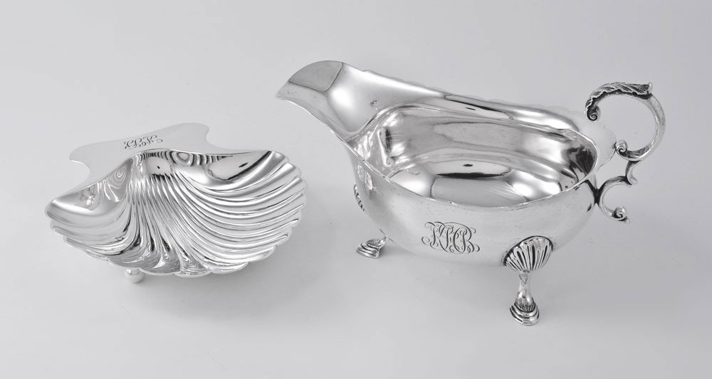 TIFFANY STERLING SILVER SAUCE BOAT & SHELL DISH: TIFFANY & CO STERLING SILVER SAUCE BOAT AND CANDY DISH: 2 piece lot to include 1) Monogrammed sauce boat on 3 hoof feet. Marked with Tiffany marks and 2 gills. 4'' h. x 6 1/2'' x 3 7/8''. 2) Monogramm