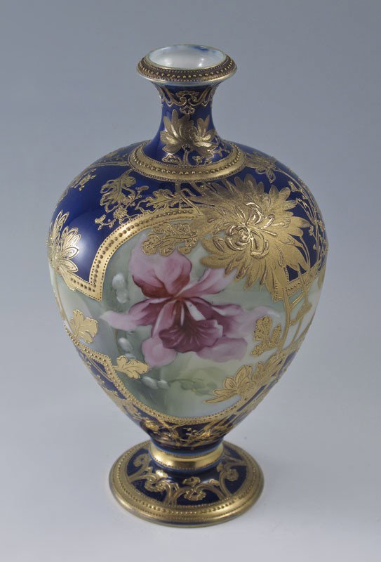 NIPPON HAND PAINTED PORCELAIN VASE: NIPPON HAND PAINTED PORCELAIN VASE: Rare orchid design centered by rich gilding on cobalt ground. Murimura Bros. wreath mark. 9 1/2".