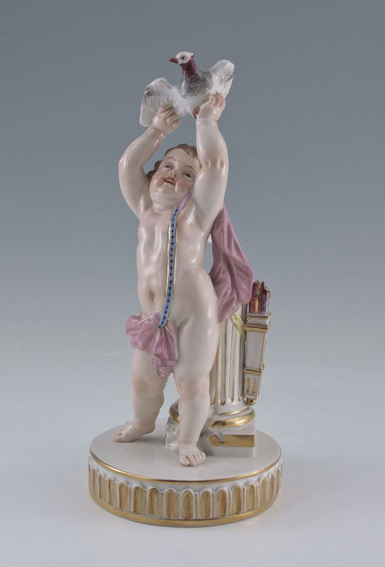 MEISSEN PORCELAIN FIGURE OF CUPID: MEISSEN PORCELAIN FIGURE OF CUPID: Finely detailed figure of cupid with arrows in waiting, arms raised to send off a bird. Crossed sword mark, 8" tall, the round base 3 1/2" dia.