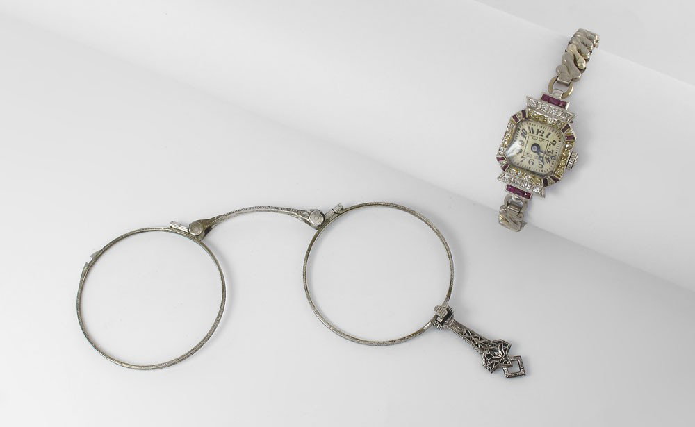 ART DECO 18K DIAMOND & RUBY LADIES DRESS WATCH: ART DECO 18K DIAMOND AND RUBY LADIES DRESS WATCH: Ebel 18K white gold watch Ca. 1920's. 16 jewel mechanical Swiss movement. Approx.. .25 Ct. of diamonds and .10 Ct of rubies. The crown is original. Th