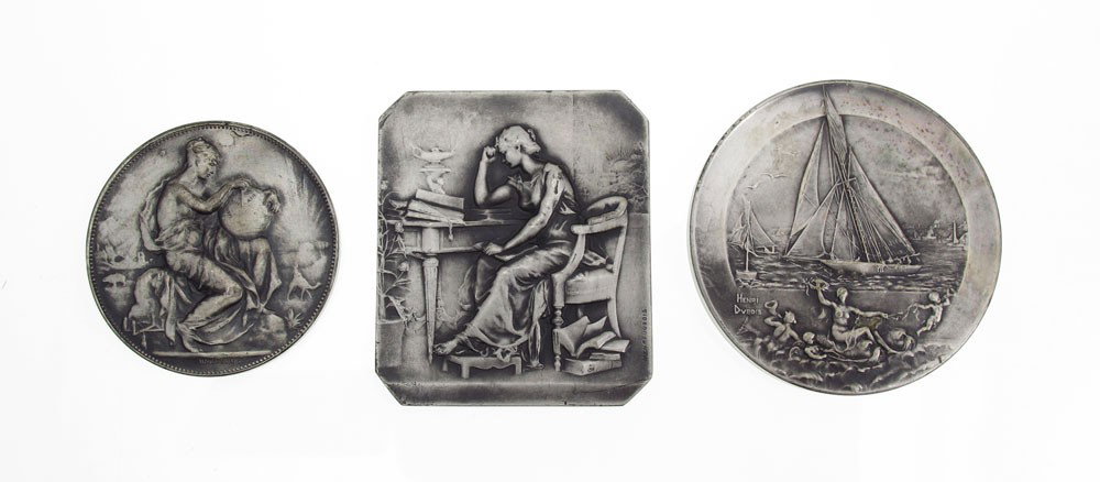 3 PC MEDAL LOT ALPHEE AND HENRY DUBOIS: 3 French Silver Medallion Plaques: 2 by Henry Du Bois, (French 1859-1930), depicting a pensive woman seated at a desk, verso depicts foliage sprig, signed, marked 'Argent'', 2'' x 1 3/4''; 2) Maritime
