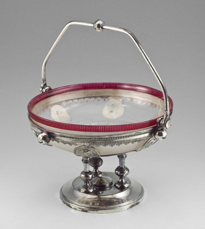 PAIRPOINT PEPPERMINT GLASS BRIDES BASKET: PAIRPOINT PEPPERMINT GLASS BRIDES BASKET: Cranberry rimmed frosted glass bowl in a Reed & Barton medallion sioverplated holder. Bowl is 7 3/4" dia. Basket is 5 1/2" tall excluding handle.