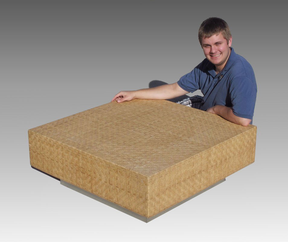 MILO BAUGHMAN 1970'S CANED COFFEE TABLE: 1970'S MODERN MILO BAUGHMAN BAMBOO CANED COFFEE TABLE: Brushed aluminum base, Approx. 14.5" tall x 38" square.