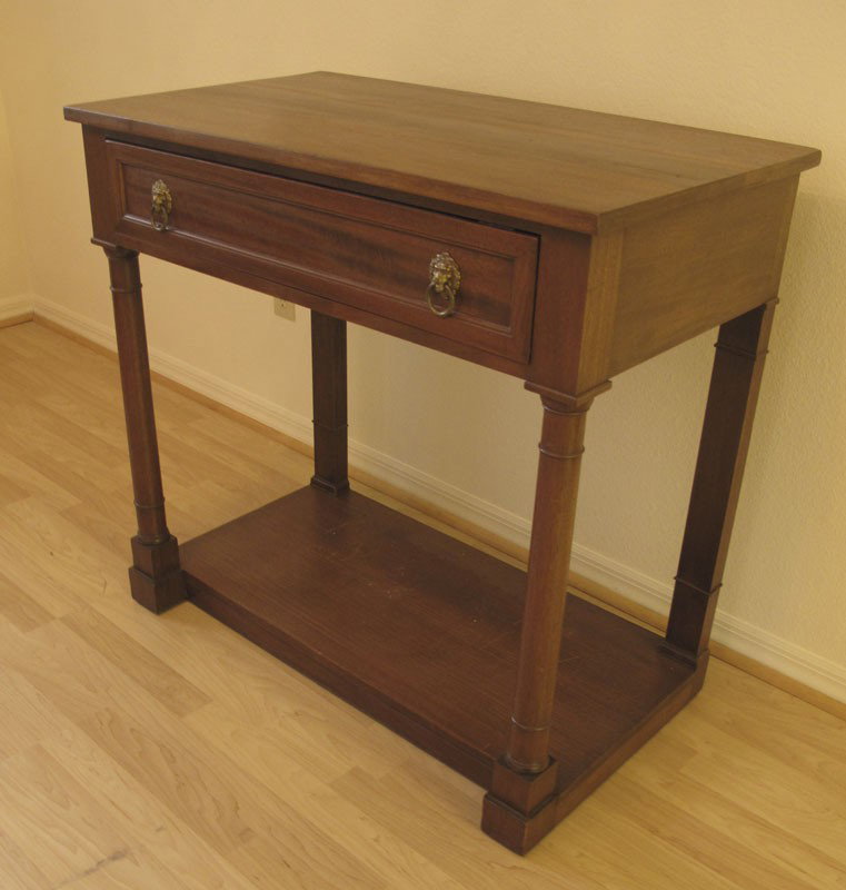 KITTINGER MAHOGANY FOYER TABLE: KITTINGER MAHOGANY FOYER TABLE: Empire style single drawer stand, columnar legs, joined by lower tier. 33 1/2" h. x 35" x 20"