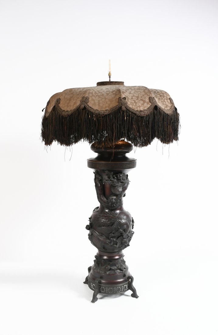 JAPANESE LATE MEIJI BRONZE DRAGON LAMP: JAPANESE LATE MEIJI BRONZE DRAGON LAMP: Massive bronze lamp with an intricately wrought dragon swirling around the top of the body. Below the dragon is a band of peacocks with turtles toward the base.