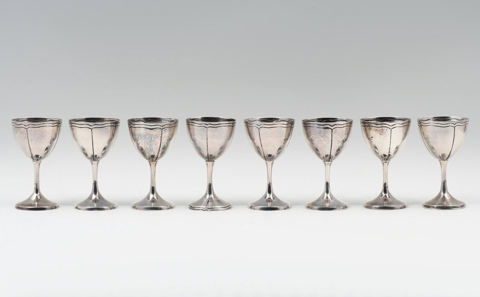 8 PC. MACIEL MEXICAN STERLING GOBLETS: 8 PC. MACIEL MEXICAN STERLING GOBLETS: Approx. 35.40 Troy ounces. 8- Sterling Goblets, having an incised floral motif. One has an incised foot. All with impressed stamps at the undersides. Approx. 4.5
