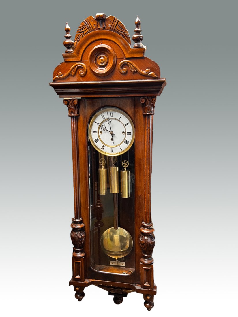 GERMAN GUSTAV BECKER WALL CLOCK: GERMAN GUSTAV BECKER WALL CLOCK: German-made Gustav Becker weight & cable-driven regulator wall clock in elaborately carved wood case. Brass hardware includes weights, pendulum, and winding key. Ename