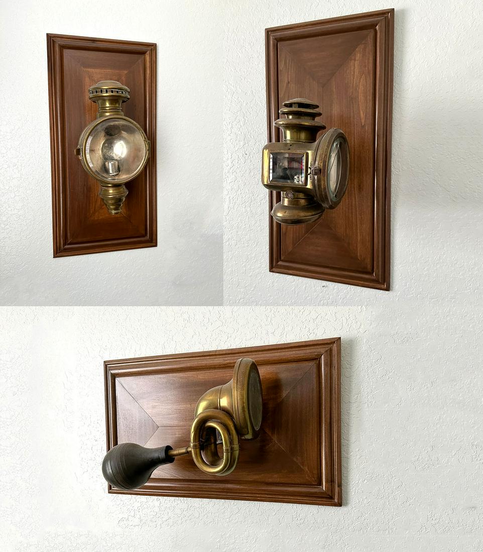 3 PC. MOUNTED ANTIQUE AUTOMOBILE LANTERNS & HORN: 3 PC. MOUNTED ANTIQUE AUTOMOBILE LANTERNS & HORN: Comprising; 1- Antique Automotive Horn, & 2- Automobile Lamps. All three are attached on custom made mounts. Largest Approx. 29.75'' h x 15'' w x 7''