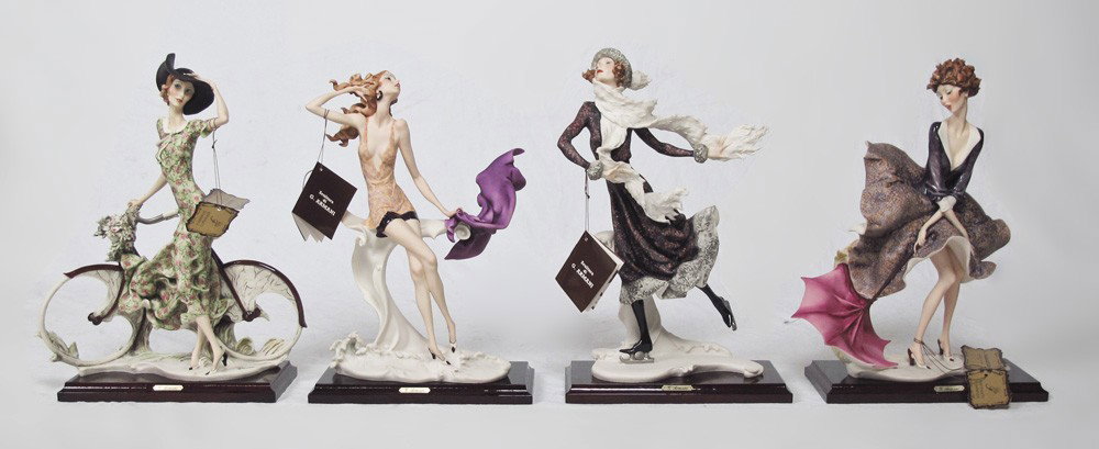 GIUSEPPE ARMANI SEASONAL FIGURINES: GIUSEPPE ARMANI 1989 SEASONAL FIGURINES: Spring GIRL WITH BICYCLE 539 C; Summer GIRL AT SEA 540 C; Fall GIRL WITH UMBRELLA 541 C; Winter GIRL WITH ICE SKATES 542 C. "Florence sculture d'arte" Made in 