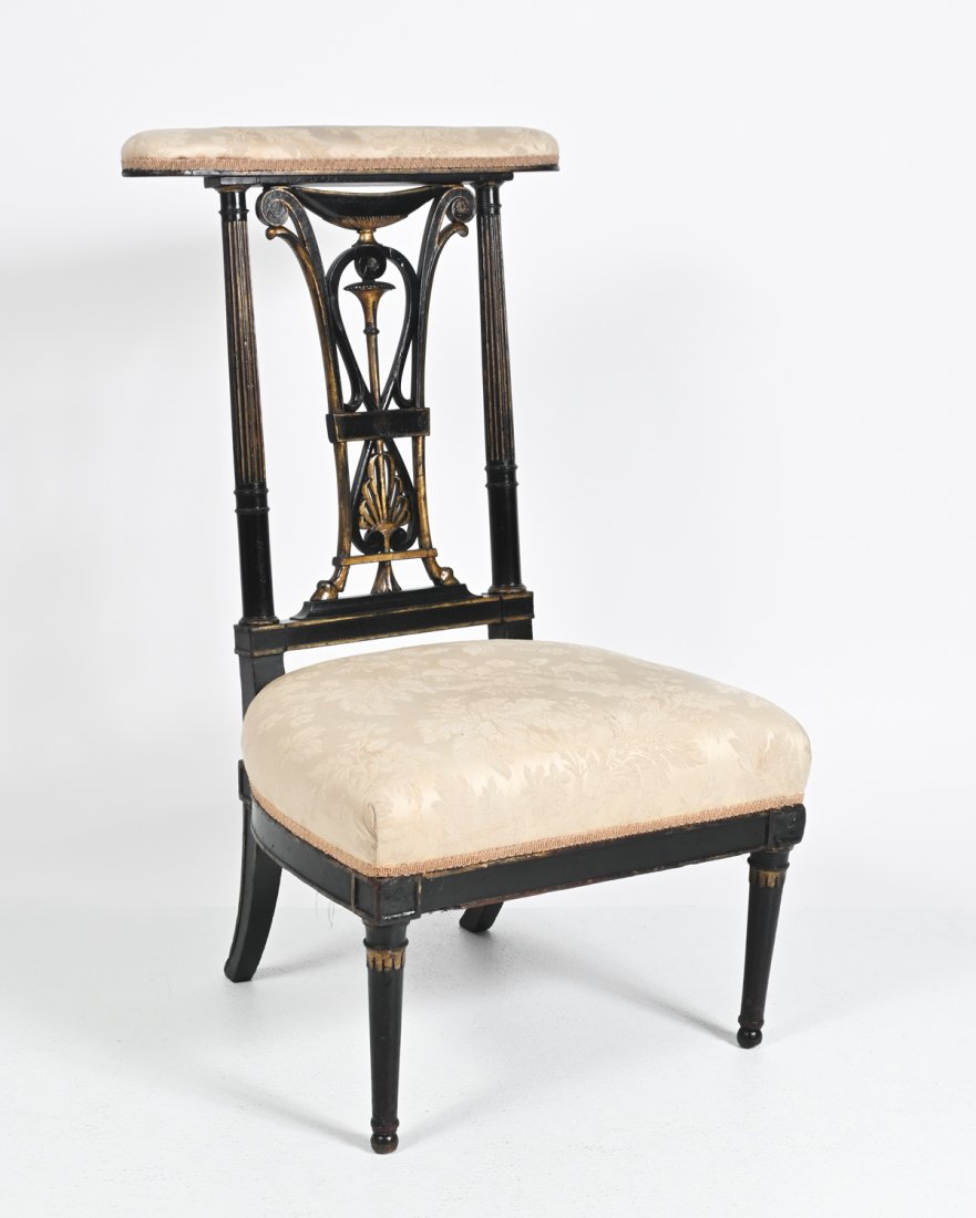19TH-CENTURY PRIE-DIEU PRAYER CHAIR: 19TH-CENTURY PRIE-DIEU PRAYER CHAIR: Ebonized wood frame with contrasting gilt accents. This kneeler features fluted columns flanking an unusual backrest having hoofs near the nicely padded knee rest.