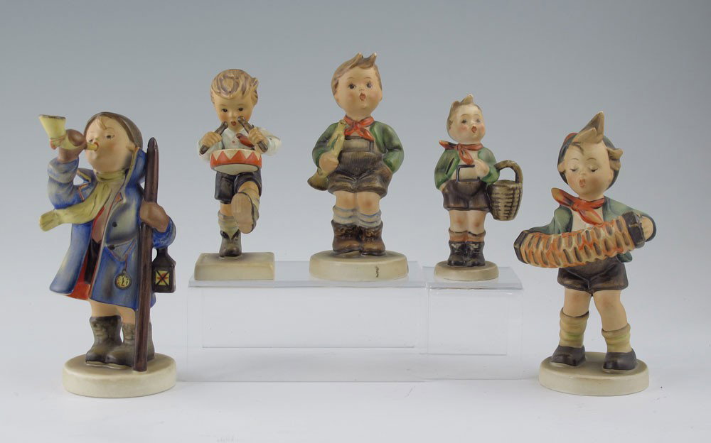 HUMMEL FIGURINES 4 FULL BEE MARKS 1 TMK 3: HUMMEL FIGURINES - 4 FULL BEE MARK 1 TMK 3: To include, HEAR YE! HEAR YE! #15/0, Germany, 5 1/2''h.; ACCORDION BOY #185, Germany, 5 3/4''h., very slight crazing; VILLAGE BOY #51 3/0, Germany, 4'', sli