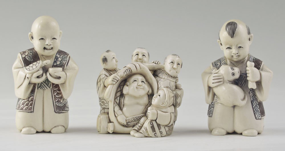 3 PIECE FIGURAL CARVED IVORY NETSUKE: 3 PIECE FIGURAL CARVED IVORY NETSUKE: To include 1) Figural group, Buddha with attendants, signed, 1 3/4" x 2". 2) Young boy with dog and bone, signed, 2 1/2" h. 3) Young boy with turtle and cup, sign