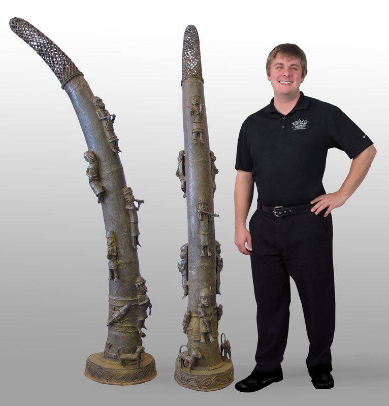 PAIR BENIN AFRICAN BRONZE ALTAR TUSKS SCULPTURE: PAIR BENIN AFRICAN BRONZE ALTAR TUSKS SCULPTURE: Approx. 72 1/2" x 11" x 20" each.
