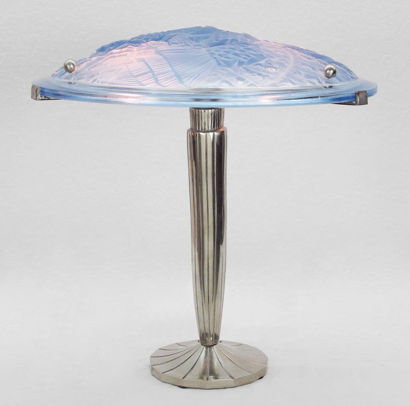 BLUE GLASS GEOMETRIC ART DECO LAMP: BLUE GLASS GEOMETRIC ART DECO LAMP: Frosted blue glass geometric molded shade over silvered 2 light base. Unmarked. Shade most likely converted from hanging lamp. Shade 2 1/4" h. x 14 1/4", overall 14
