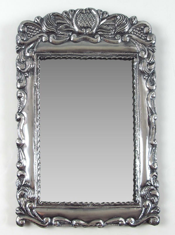 SILVER REPOUSSE WALL MIRROR: SILVER REPOUSSE WALL MIRROR: Repousse floral motif over wood backing, hinged back for ease of mirror or picture placement. Illegible hallmark, possible Argentinian, .900 silver. 19" h. x 13 1/4".