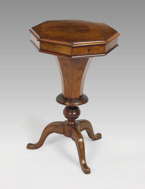 REGENCY BURL WALNUT WORK TABLE: REGENCY BURL WALNUT WORK TABLE: Octagonal top hinged and lifts to the paper lined and compartmented interior. Approx. 28" tall x 17" dia.