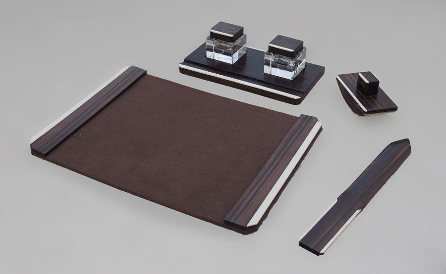 ART DECO ROSEWOOD & IVORY DESK SET: ART DECO ROSEWOOD & IVORY DESK SET: Early 20th century. to include 1) 2 wells with crystal bases, rosewood and ivory tops. 2 3/4" h. x 2 7/8". Stand for wells 11 1/2" x 6 3/8". 2) Blotter, 2 3/4" x 5