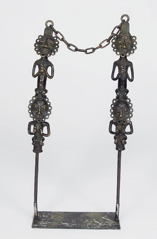 2 AFRICAN BRONZE FIGURAL SPEAR TOTEMS SCULPTURE: 2 AFRICAN BRONZE FIGURAL SPEAR TOTEMS SCULPTURE: Each connected to other by chain. With stand. 28 1/4" h. x 13 1/2" x 5".