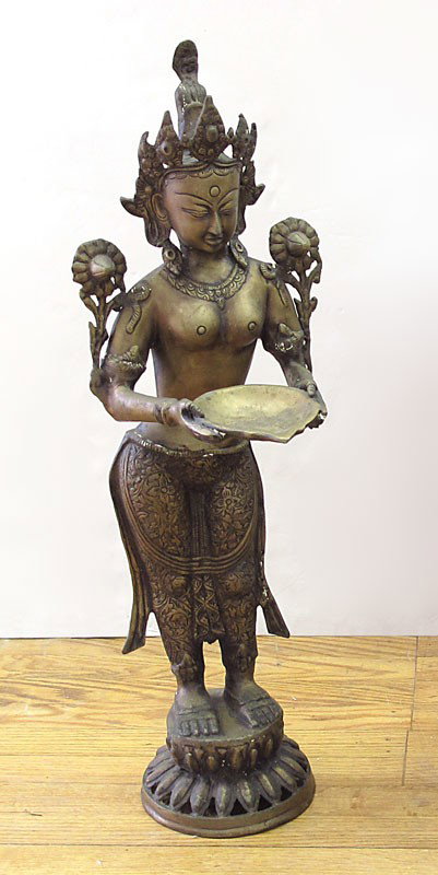 THAI BUDDHIST BRONZE DEITY SCULPTURE: THAI BUDDHIST BRONZE DEITY SCULPTURE: Buddhist deity holding offering plate. 29 1/2" h. x 10" x 9 3/4".