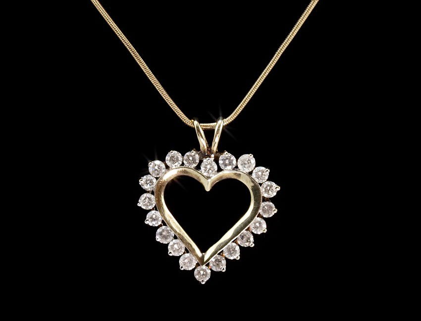 1 CT DIAMOND HEART NECKLACE 5.6 GR 14K GOLD: DIAMOND HEART PENDANT NECKLACE: 14K yellow gold pendant contains 20 round full cut diamonds. Weight: 1.00 Ct. Approx. The diamonds average I1-I2 in clarity and I-J in color. The diamonds are prong set