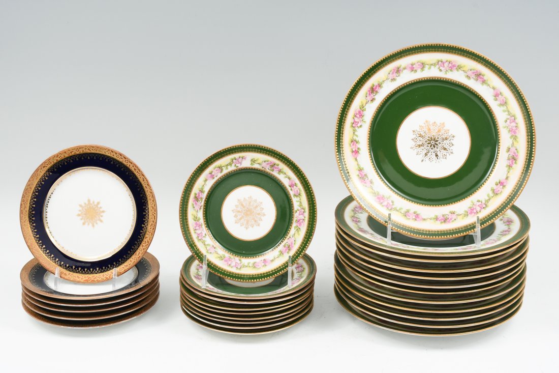 LIMOGES AND SEVRES PLATES: LIMOGES AND SEVRES PLATES: Twelve William Guerin & Co. Limoges salad plates having a gilt green & floral band with center gold medallion. Approx. 8.5" in diameter. With nine matching bread & butter pl