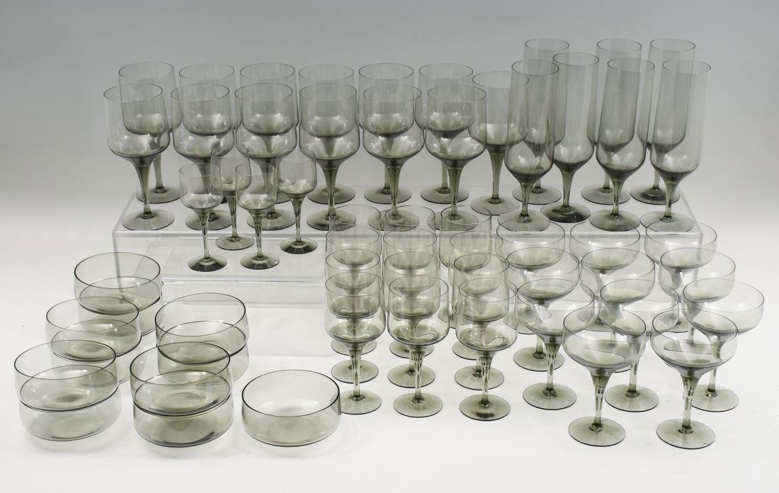 58 PC. SMOKED CRYSTAL STEMWARE: 57 PC. ORREFORS SMOKED CRYSTAL STEMWARE: Mid-century Rhapsody Smoke by Orrefors; smokey gray crystal glassware includes 4- Aperitif glasses, 12- Claret glasses, 10- Champagne Coupes, 7- Champagne Flut