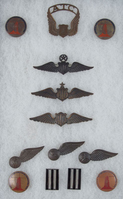 COLLECTION OF US ARMY AIR TRANSPORT COMMAND WINGS: COLLECTION OF US ARMY AIR TRANSPORT COMMAND WINGS & PINS: Bronze wings to include Chief Pilot, Captain, First Officer, Radio Engineer wing, Flight Navigator wing, Flight Engineer wing, Cap badge, 4 AT