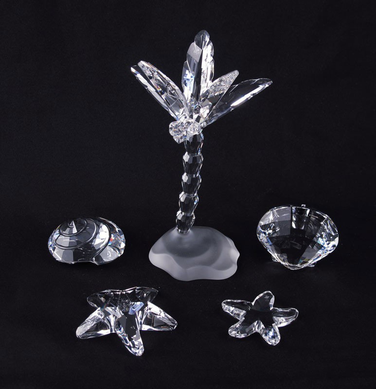 SWAROVSKI CRYSTAL PALM TREE & SHELLS: SWAROVSKI CRYSTAL FIGURINES: To include, PALM TREE 7475, M. Stamey, issued 2004 retired 2007, with box, sleeve & cert; 2005 Member STARFISH 7400 200 502, Anton Hirzinger, no box or cert; 2006 Member S