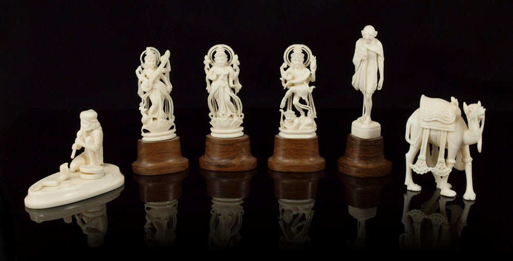 6 PIECE CARVED IVORY: 6 PIECE COLLECTION OF CARVED IVORY FIGURES: To include 1) Snake charmer with cobra, pencil signed Inyo, 2" h. x 3 1/4" x 1 7/8". 2) Detailed carved camel, unsigned, 2 1/2" h. x 2". 3) Carved model of 
